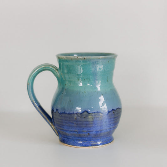 blue and aqua mug on a white background