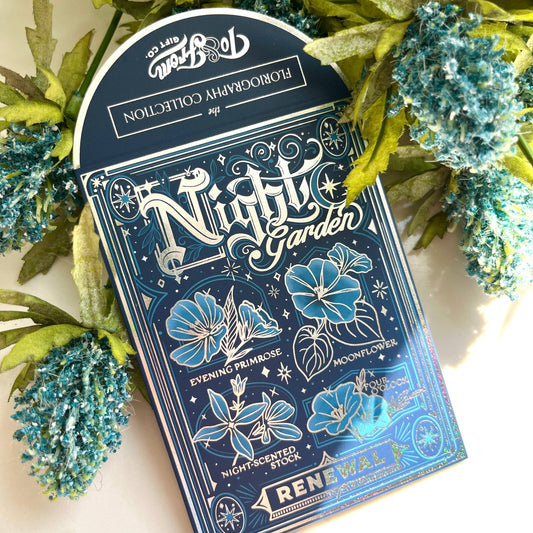 Pack of 'Nightly Garden' flowers seeds with decorative packaging on a floral background