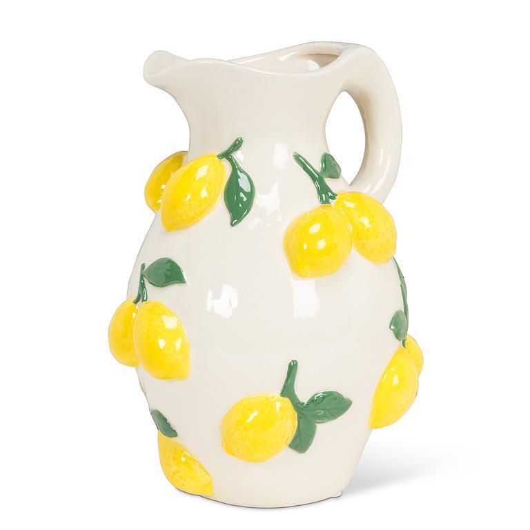 Ceramic pitcher with lemon design on a white background