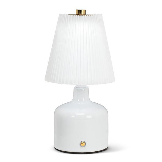 White table lamp with a pleated shade on a white background