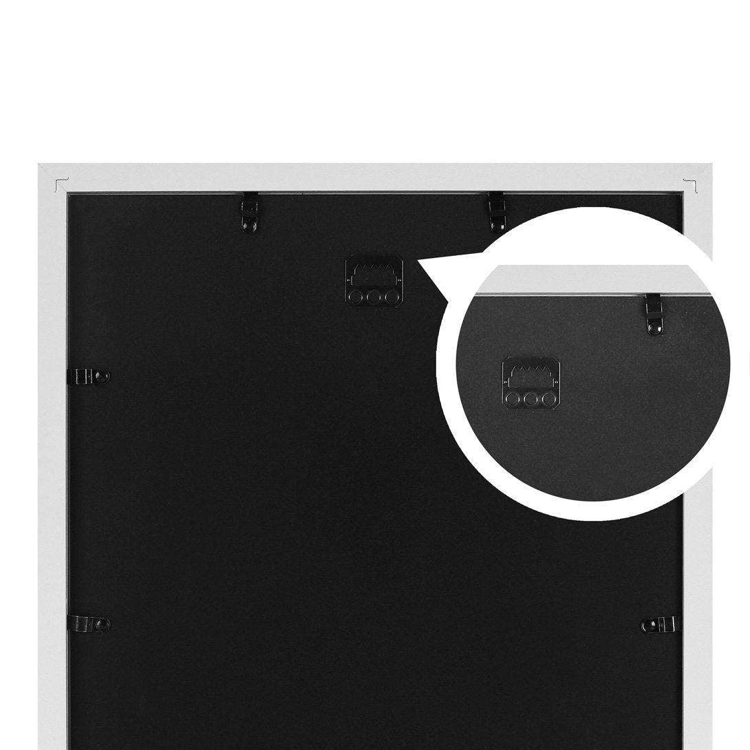 Back view of a picture frame with a white border on a black background
