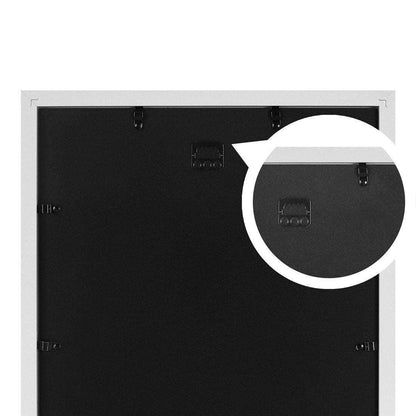 Back view of a picture frame with a white border on a black background