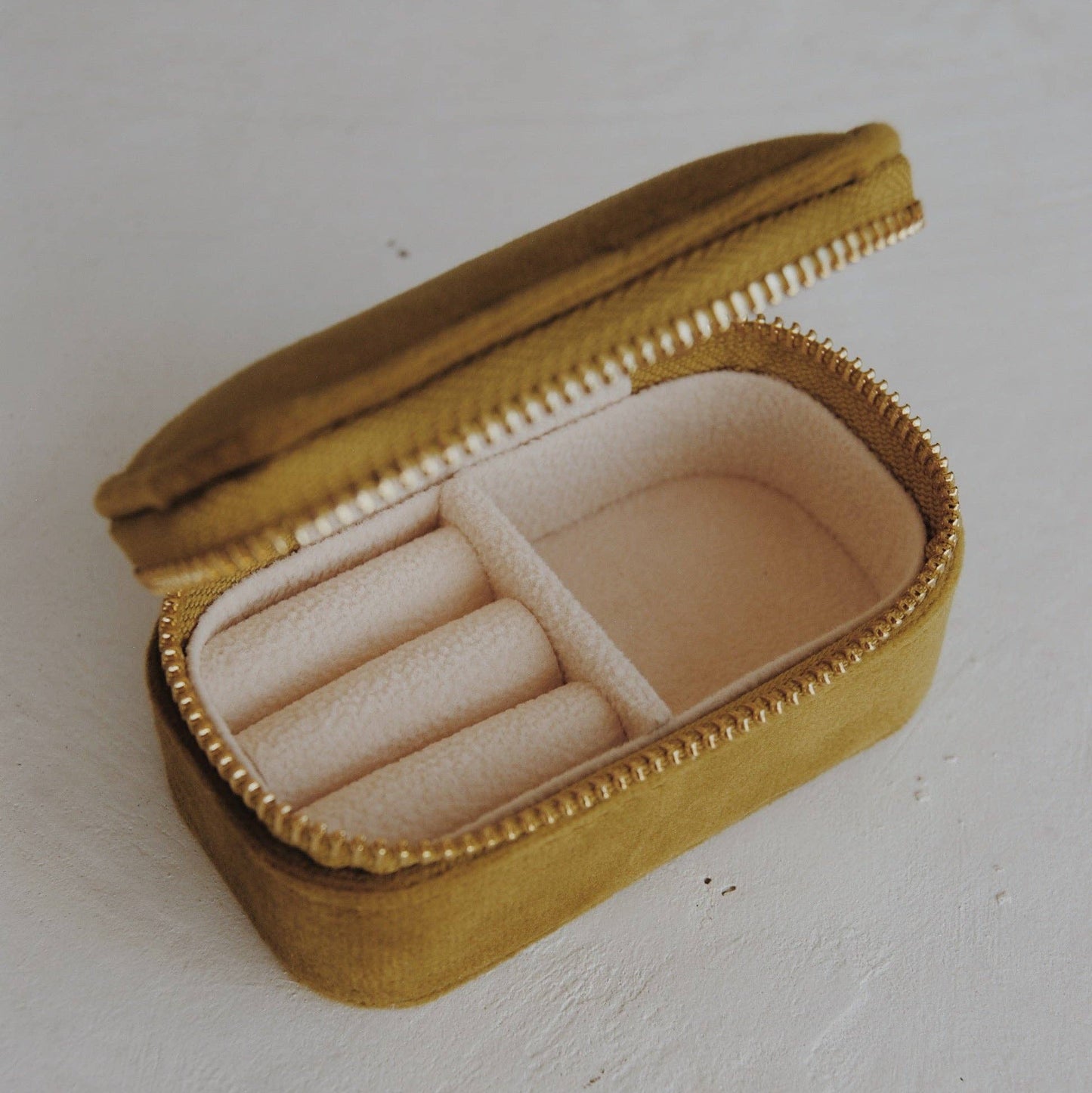 Chartreuse jewelry box with a ring on a white background